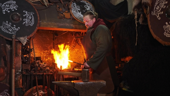 the-smith-viking-working-hard-in-a-smithy-stock-footage-videohive