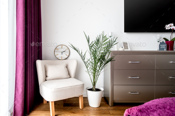 Decoration details, armchair and tv stand in modern bedroom Stock Photo by stockcentral