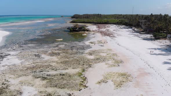 The Rock Restaurant in Ocean Built on Stone at Low Tide on Zanzibar Aerial View alt