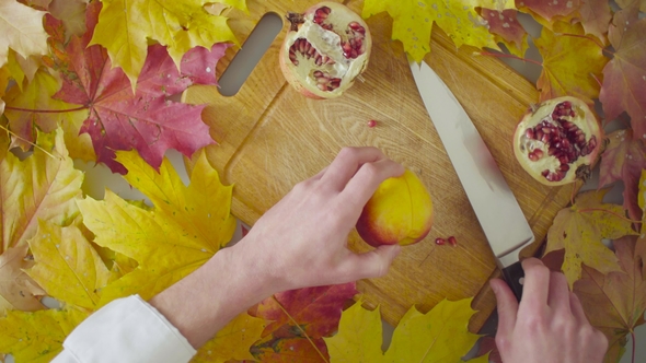 Autumn Naturemorte. Chef Cutting a Peach
