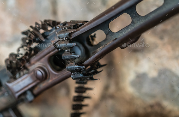 Detail of an old disused machine gun - Stock Photo - Images