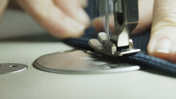 Slowly Process of Stitching a Jacket with Sewing Machine, Stock Footage