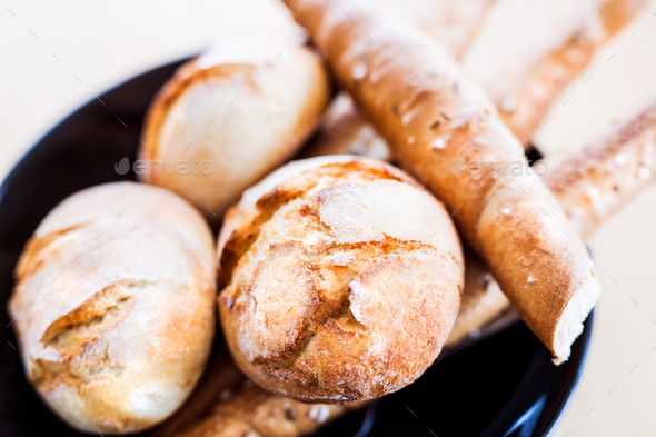 Composition of bread buns and sticks on the table. Close up. - Stock Photo - Images