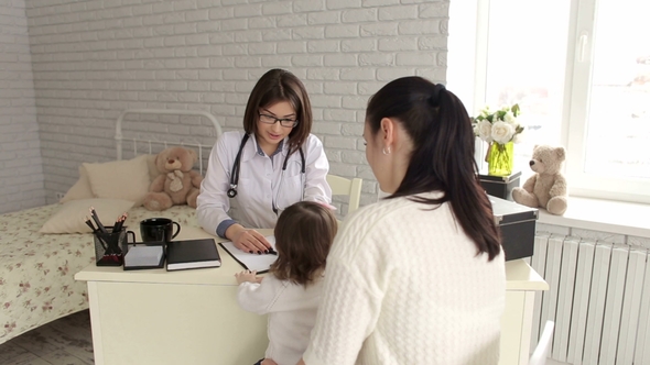 Mother and Daughter at Pediatrician's Examination.