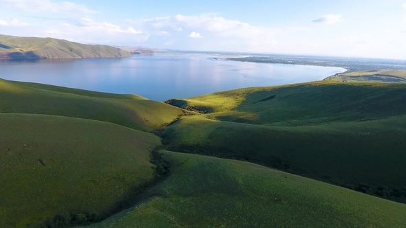 Aerial View of the Green Hills, Cloudy Sky and the Yenisei River in the Republic of Khakassia