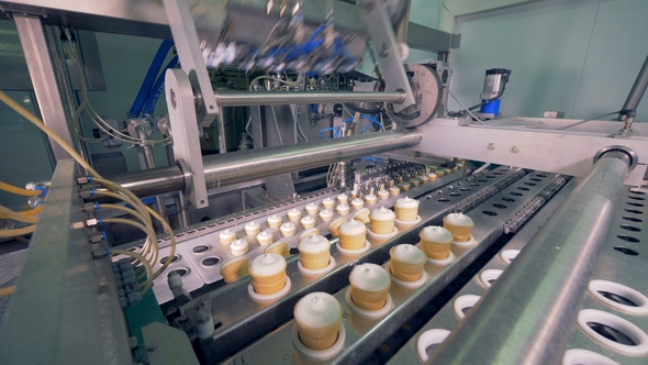 Sets of Ice-cream in Wafer Cups Are Being Displaced By Industrial Machine alt