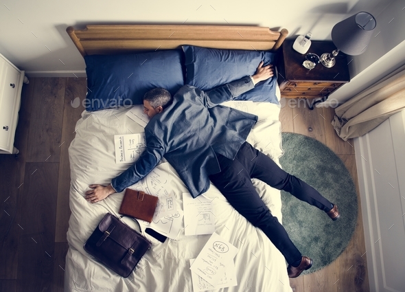 Exhausted business man falling asleep as soon as he came back home Stock Photo by Rawpixel