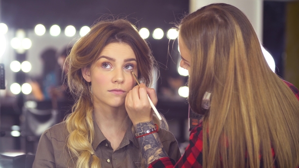 Makeup Artist Applying Eyeshadow