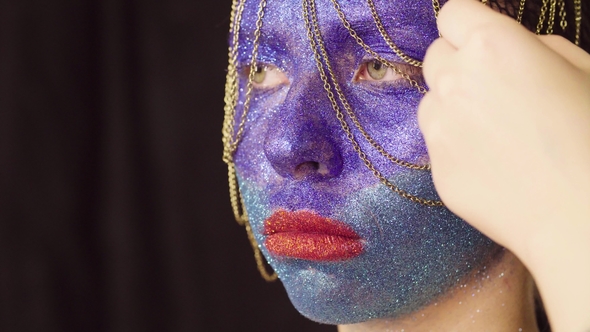 Face Art. The Make-up Artist Decorating Hair