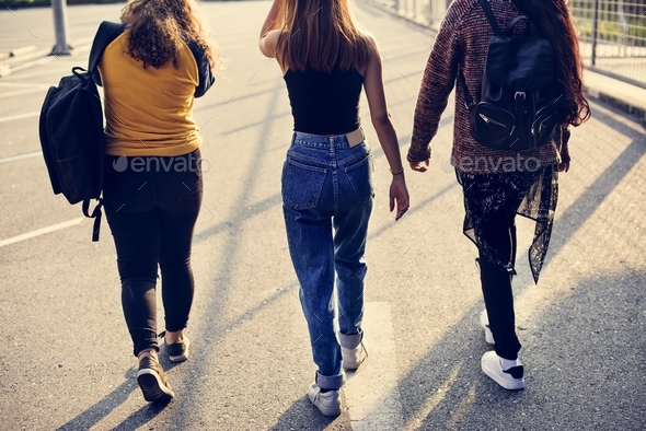Teenage girl friends walking together - Stock Photo - Images