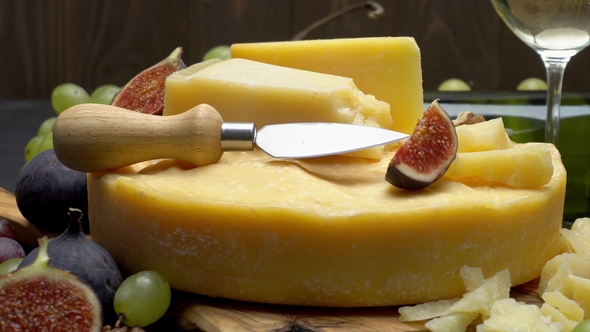 Video Whole Round Head of Parmesan or Parmigiano Hard Cheese, Grapes and Wine alt