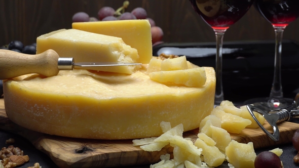 Video Whole Round Head of Parmesan or Parmigiano Hard Cheese, Grapes and Wine alt