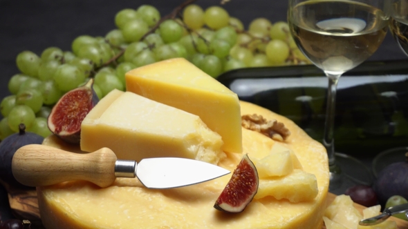 Video Whole Round Head of Parmesan or Parmigiano Hard Cheese, Grapes and Wine alt