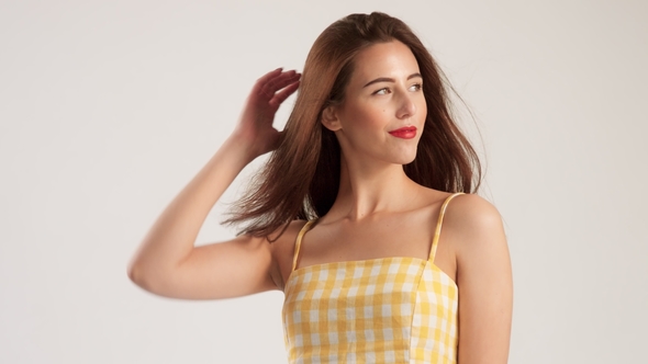 Woman Wears Summer Look in Studio with Blowing Hair