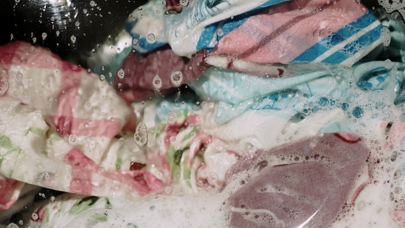 Washing Clothes in the Washing Machine alt