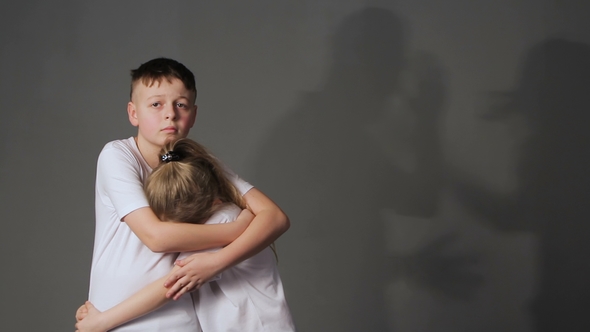 Little Boy and Girl and Silhouettes of Quarreling Parents on Background. Shadows of Parents Fighting