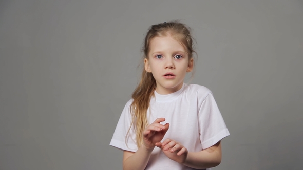 Scared Young Girl Expressing Fear Emotion Isolated on Grey Background. Concept of Emotions