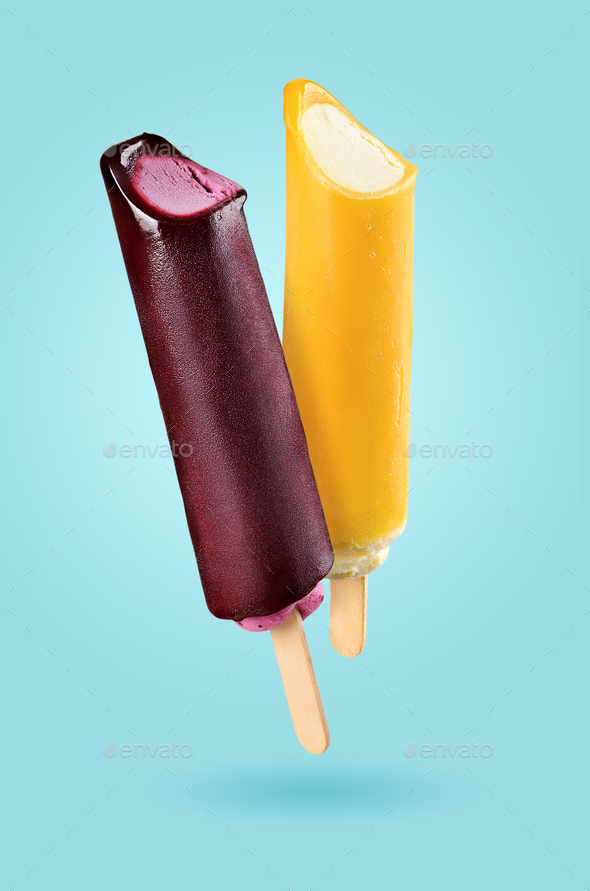 Yellow popsicle on blue - Stock Photo - Images