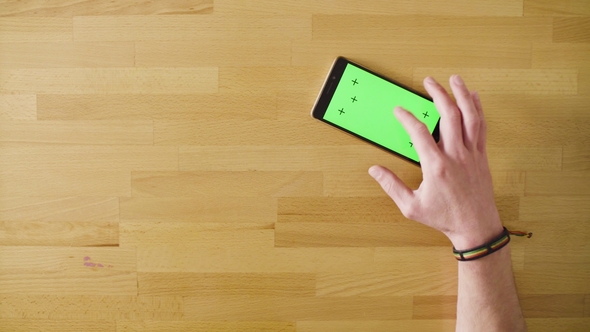 Male Hands Paying a Card in the Smartphone