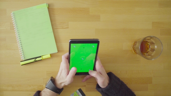 Male Hands Scrolling the Tablet