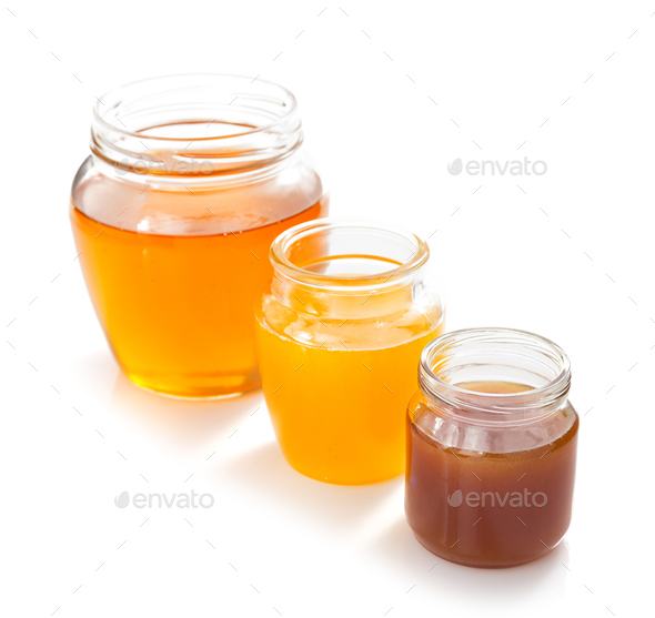 variety of honey in jar white background - Stock Photo - Images