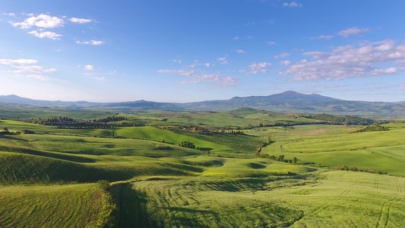 Tuscany Aerial of Farmland Hill Country at Evening alt