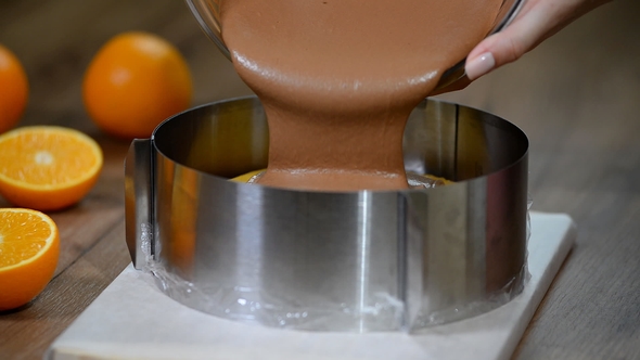 Cooking Chocolate Mousse Cake. Pouring Chocolate Mousse in the Form.