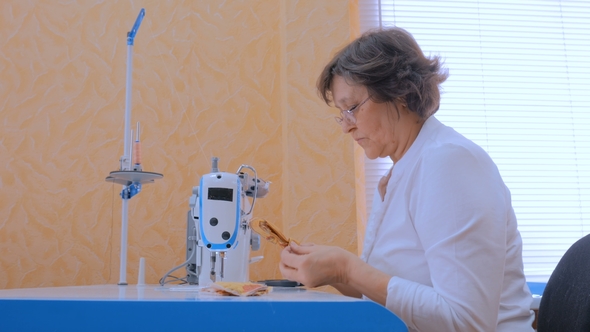 Professional Tailor, Fashion Designer Sewing Clothes with Sewing Machine alt