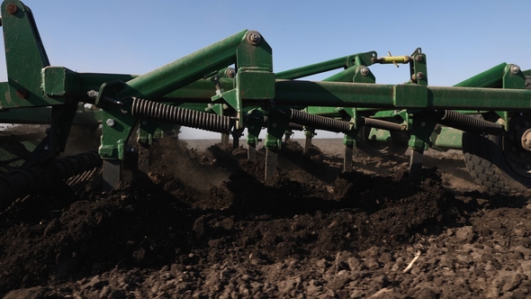 Tractor Cultivating Land in Extreme alt