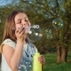 Happy Child Blowing Soap Bubbles in Spring Park - VideoHive Item for Sale