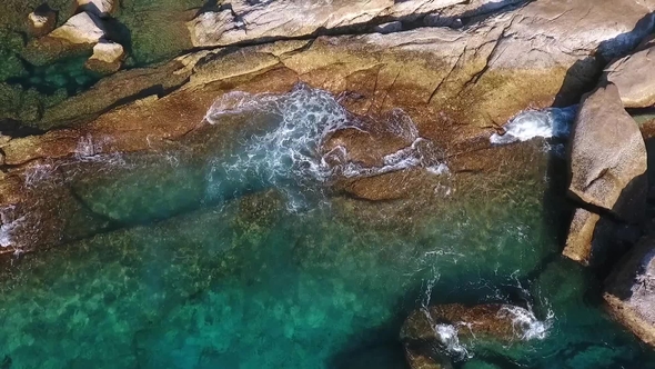 Huge Cliff Stones and Strong Blue Water Waves at Similan Island. Aerial  . Thailand. alt
