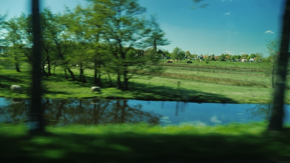 View from Car Window on the Picturesque Countryside of the Netherlands alt