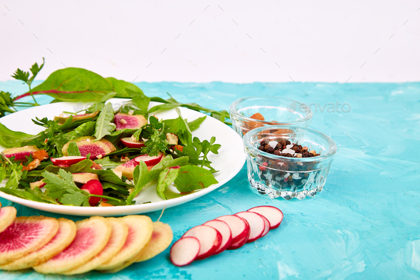 Salad in white plate around Ingredient - Stock Photo - Images