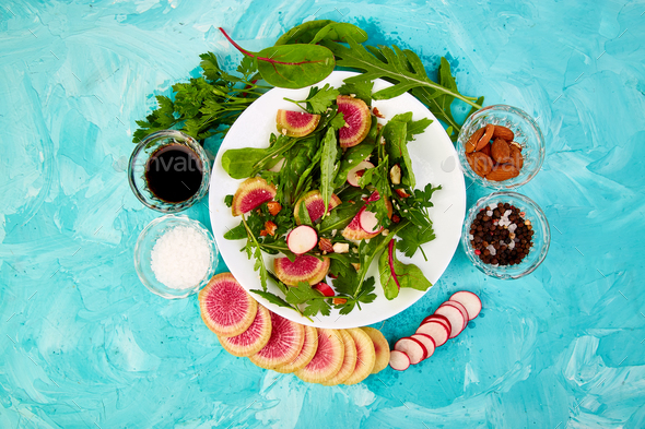 Salad in white plate around Ingredient - Stock Photo - Images