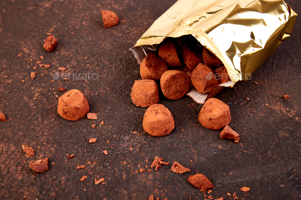 Chocolate Candy truffles fall out - Stock Photo - Images