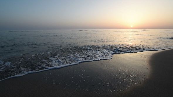 Calm Waves of the Sea on the Sandy Beach