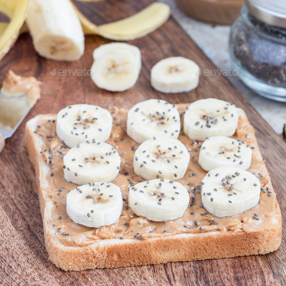 Healthy sandwich with crunchy peanut butter, banana and chia see - Stock Photo - Images