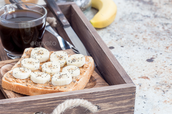 Healthy sandwich with crunchy peanut butter, banana and chia see - Stock Photo - Images
