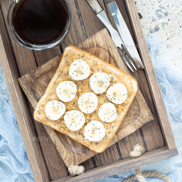 Healthy sandwich with crunchy peanut butter, banana and chia see - Stock Photo - Images