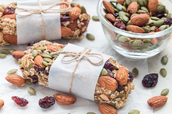 Homemade granola energy bars with figs, oatmeal, almond, dry cra Stock Photo by iuliia_n
