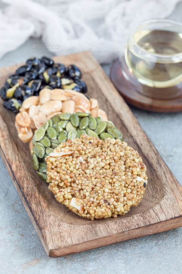 Korean traditional sweet snacks with peanuts, pumpkin seeds, bla - Stock Photo - Images