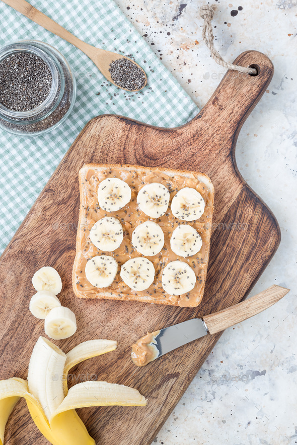 Healthy sandwich with crunchy peanut butter, banana and chia see - Stock Photo - Images