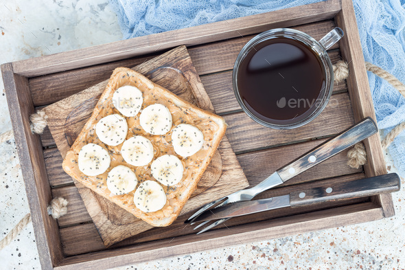 Healthy sandwich with crunchy peanut butter, banana and chia see - Stock Photo - Images