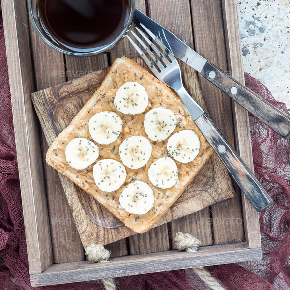 Healthy sandwich with crunchy peanut butter, banana and chia see - Stock Photo - Images