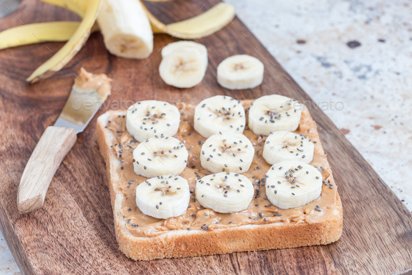 Healthy sandwich with crunchy peanut butter, banana and chia see - Stock Photo - Images