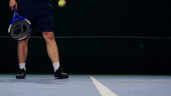 Tennis Player Holding the Ball and Getting Ready to Serve alt