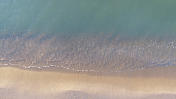 Narrow Beach Line, Waves and Ocean. Aerial View