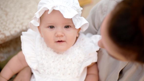 Baby Girl on Mother's Knee