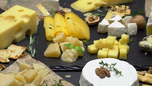 Video of Various Types of Cheese - Parmesan, Brie, Cheddar and Roquefort alt