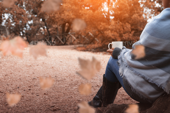 Drinking coffee in the autumn forest - Stock Photo - Images